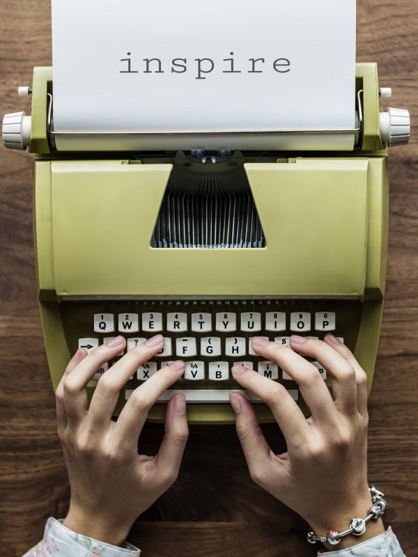 Aerial view of a man typing on a retro typewriter